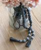 Picture of Distressed Wooden Bead Garland With Tassels